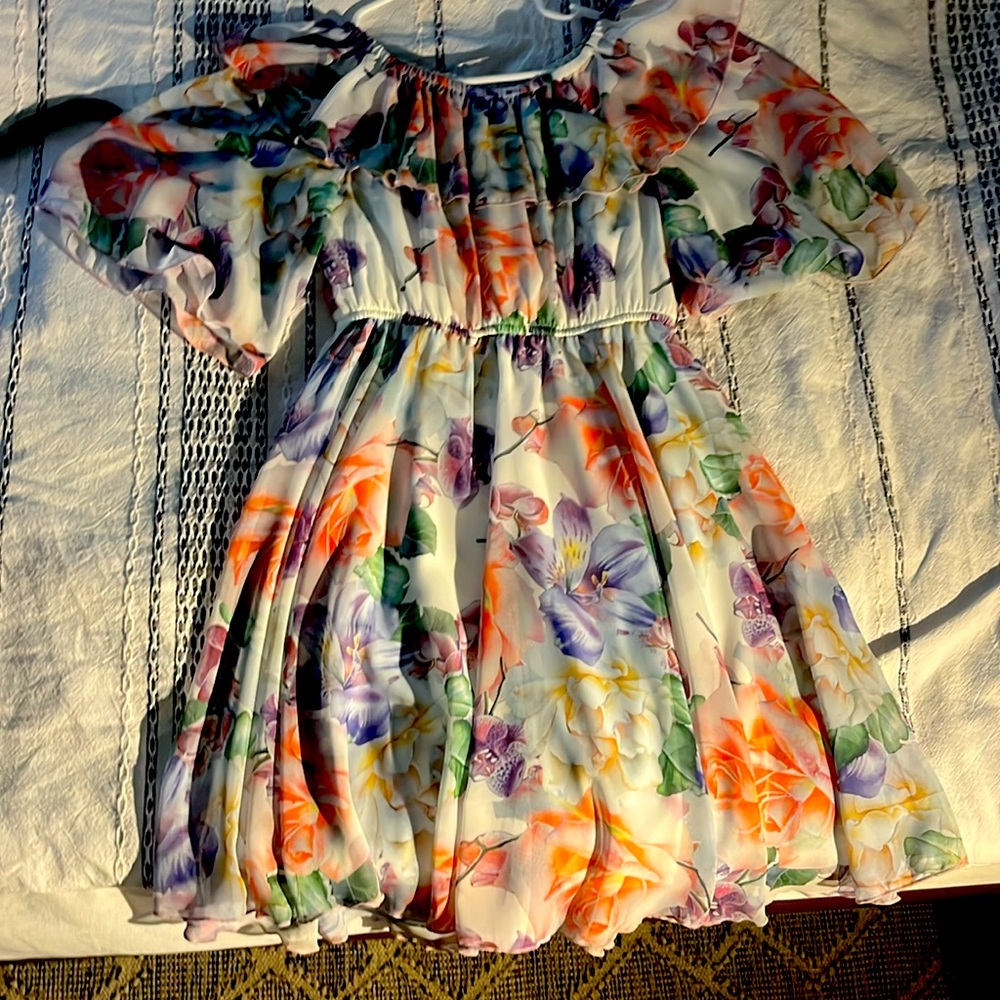 Floral dress with flowers on it, never worn, very nice material!